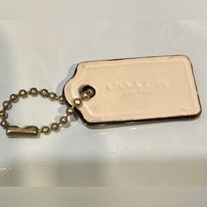 Coach two sided hang tag with chain. Approximately 1.5 inches.